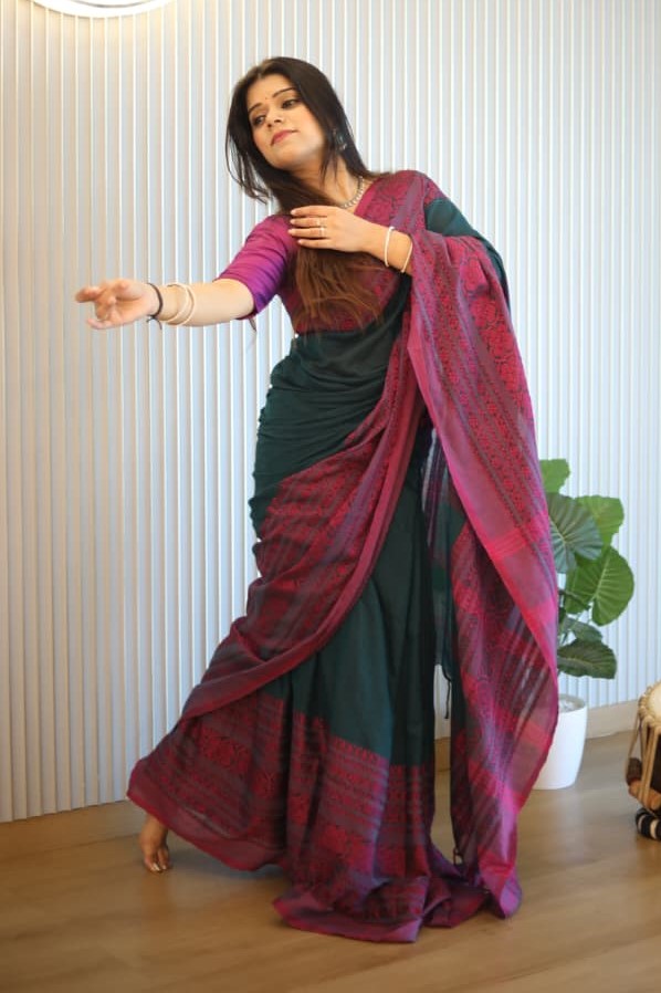 Girl wearing Handloom saree begampuri soft cotton saree which is in green and pink color