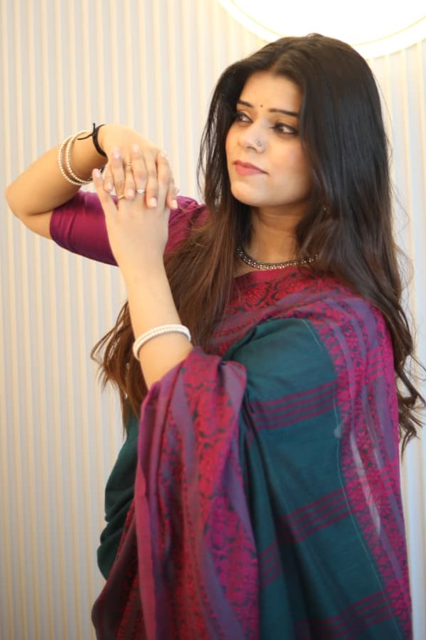 Girl wearing Handloom saree begampuri soft cotton saree which is in green and pink color