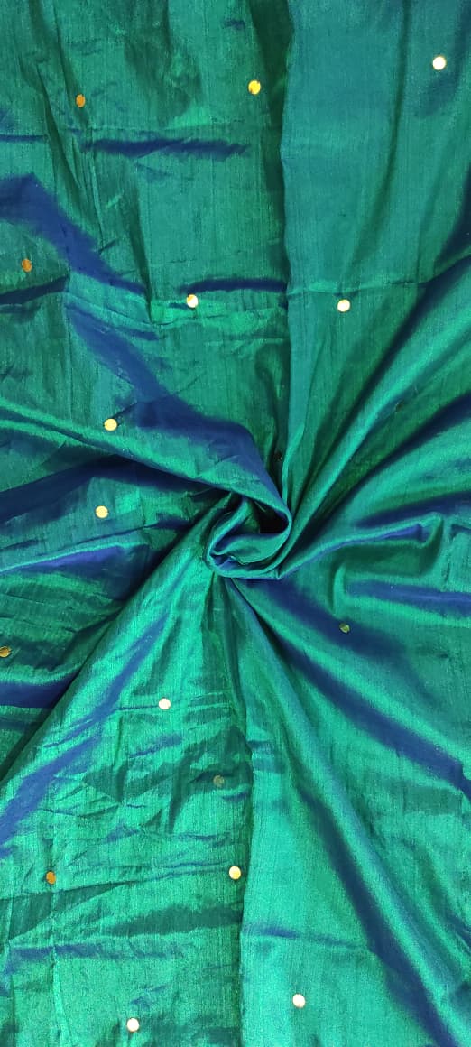 Peacock green handloom saree with shimmering copper effect and golden  work and black tassels listed to order saree online.