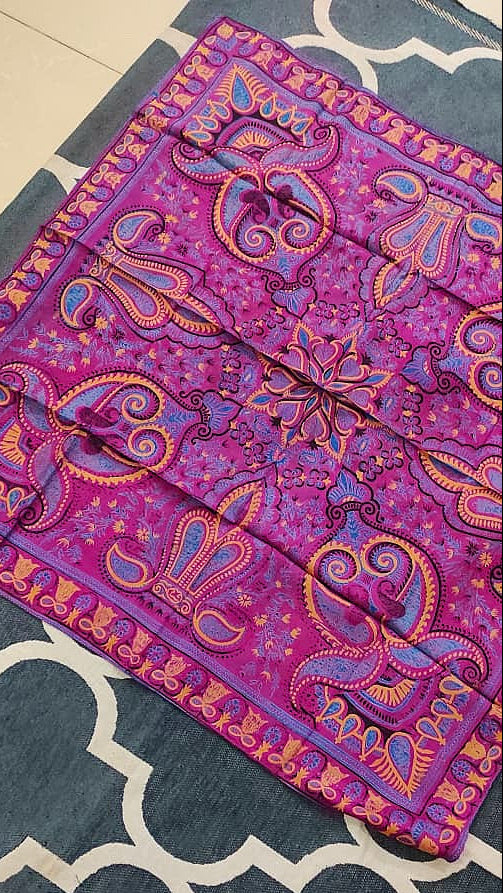 Decorative purple and pink with geometric design on a plain background