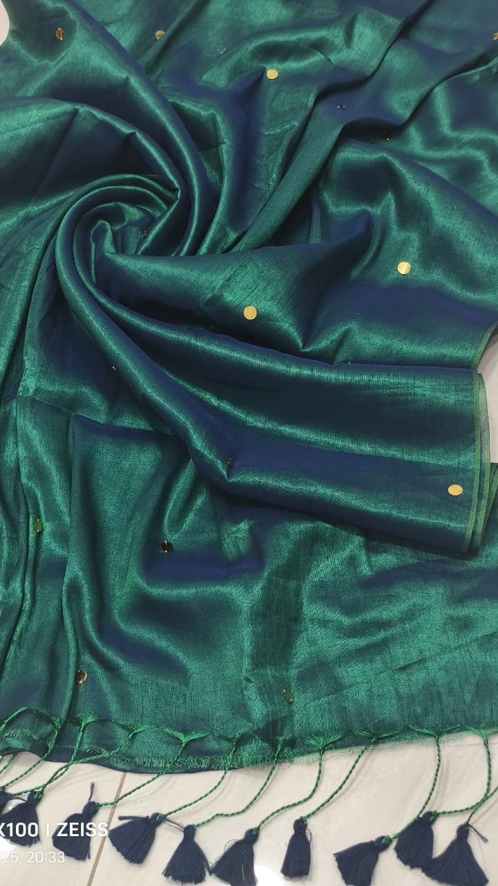 Peacock green handloom saree with shimmering copper effect and golden  work and dark green tassels listed to order saree online.